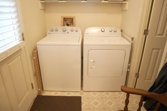 laundry room with laundry area and washer and clothes dryer