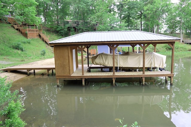 view of dock featuring a water view and boat lift
