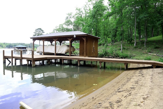 dock area featuring a water view and boat lift