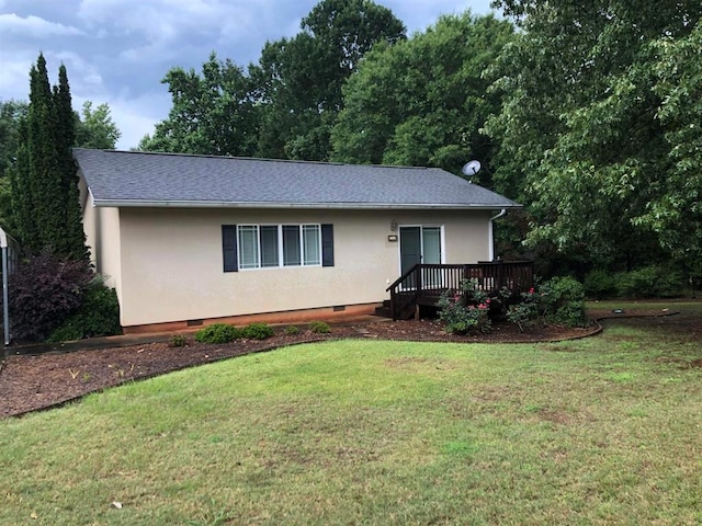 104 Wesley Ct, Eatonton, GA 31024 - single story home with crawl space, stucco siding, a wooden deck, and a front yard