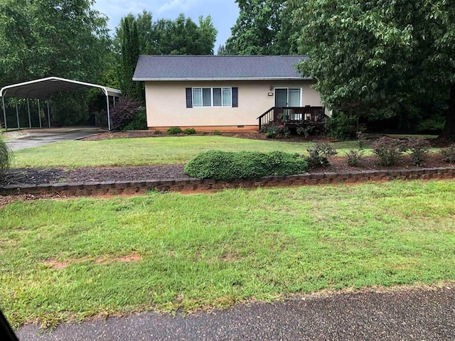 104 Wesley Ct, Eatonton, GA 31024 - ranch-style house featuring stucco siding, a detached carport, a front yard, driveway, and a wooden deck