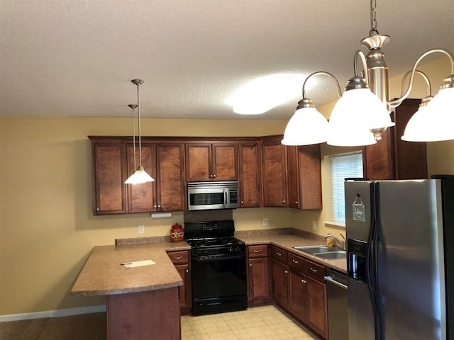 104 Wesley Ct, Eatonton, GA 31024 - kitchen featuring appliances with stainless steel finishes, a peninsula, decorative light fixtures, and light floors