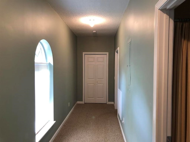 104 Wesley Ct, Eatonton, GA 31024 - corridor with a textured ceiling and carpet