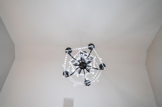 interior details with an inviting chandelier and visible vents