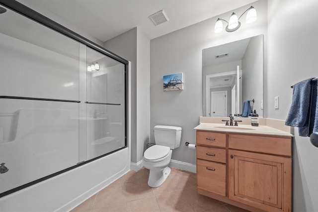 bathroom featuring visible vents, toilet, tile patterned flooring, and vanity
