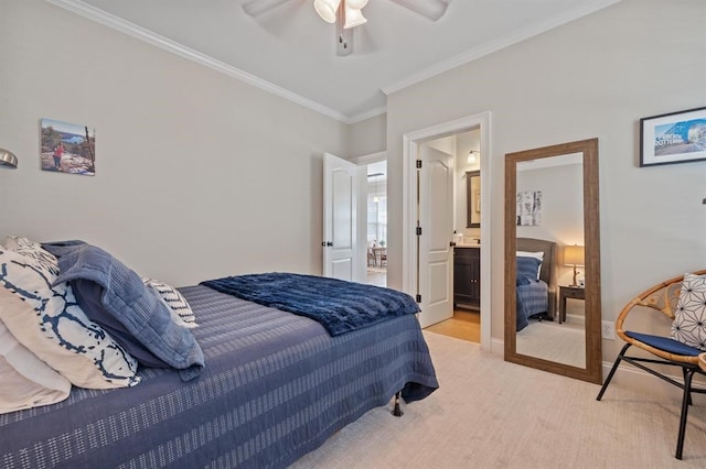 carpeted bedroom featuring baseboards, crown molding, and ceiling fan