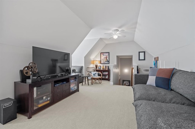 living area with light carpet, lofted ceiling, visible vents, and ceiling fan