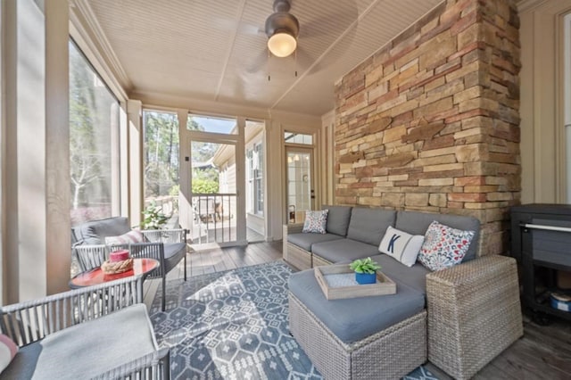 sunroom featuring an outdoor hangout area and ceiling fan