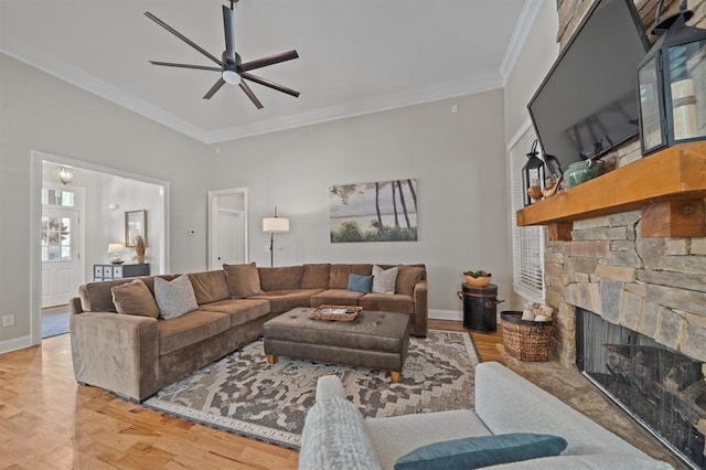 living room with a ceiling fan, ornamental molding, a fireplace, and wood finished floors