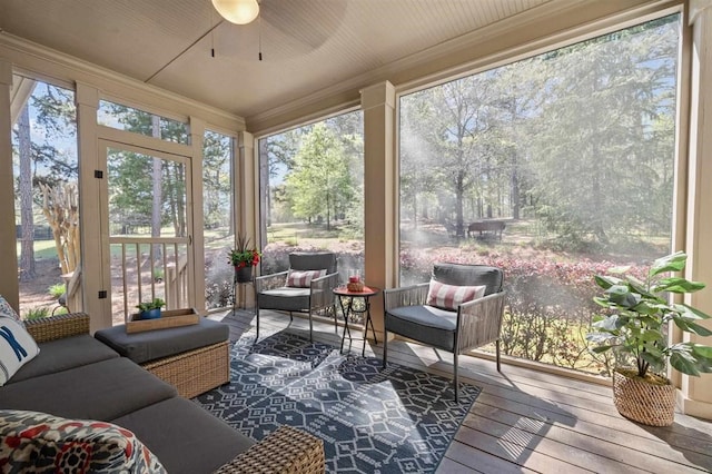 sunroom / solarium with an outdoor hangout area and ceiling fan