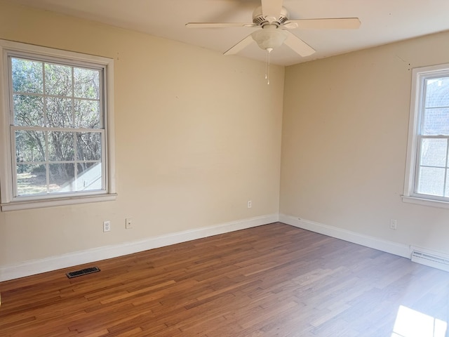 empty room featuring ceiling fan and wood-type flooring