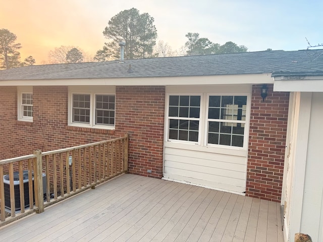 deck at dusk with cooling unit