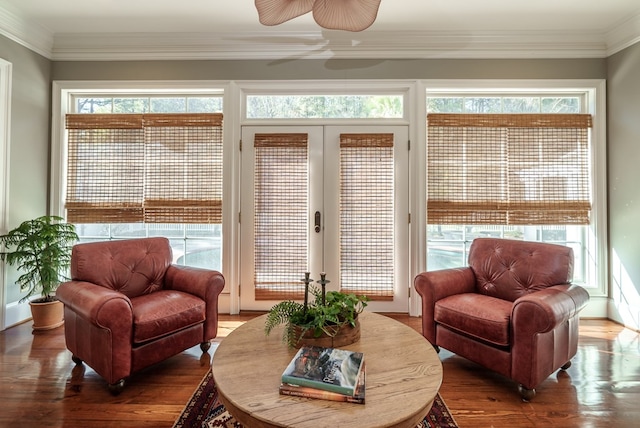 sunroom / solarium featuring french doors and ceiling fan