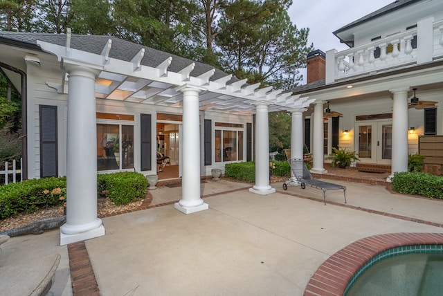 view of patio / terrace with a pergola and french doors