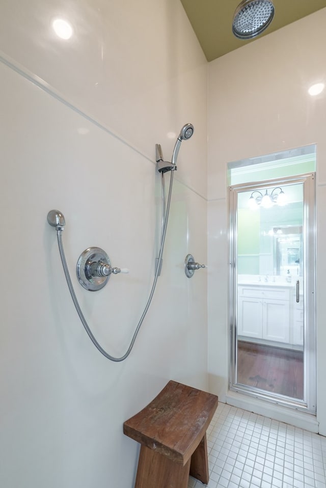 bathroom with tile patterned floors and walk in shower