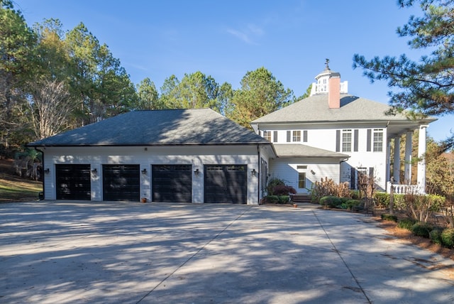 view of side of property with a garage