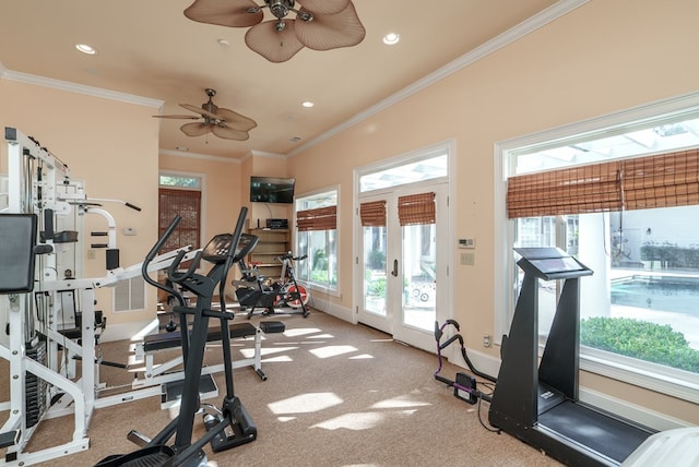 workout area with ceiling fan, light colored carpet, ornamental molding, and a wealth of natural light