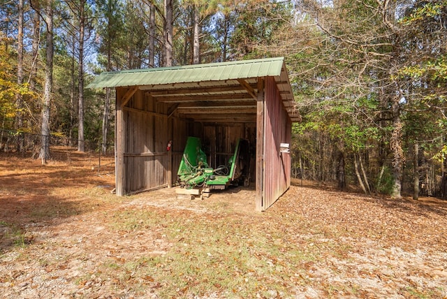 view of outbuilding featuring a carport