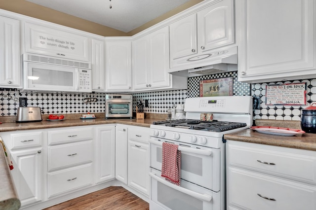 kitchen featuring white cabinetry, light hardwood / wood-style flooring, backsplash, a textured ceiling, and white appliances