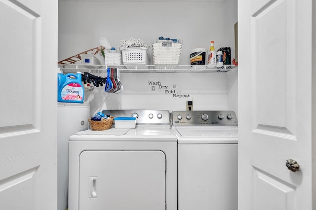 washroom with washing machine and clothes dryer