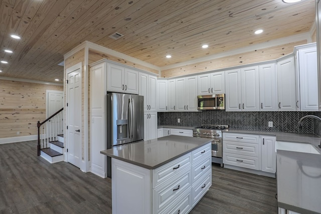 kitchen featuring white cabinets, wood ceiling, and appliances with stainless steel finishes