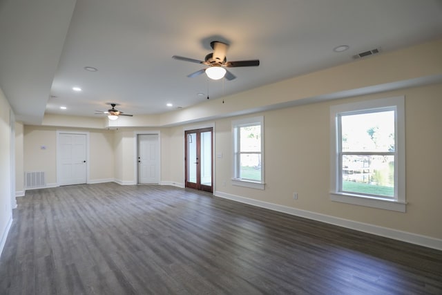 empty room with ceiling fan and french doors