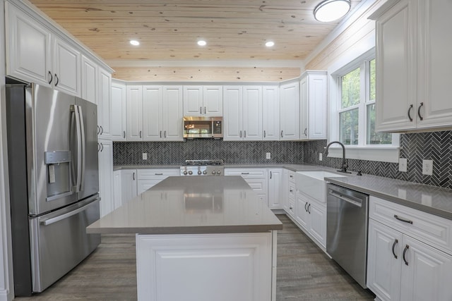 kitchen with white cabinetry, a center island, wooden ceiling, and appliances with stainless steel finishes