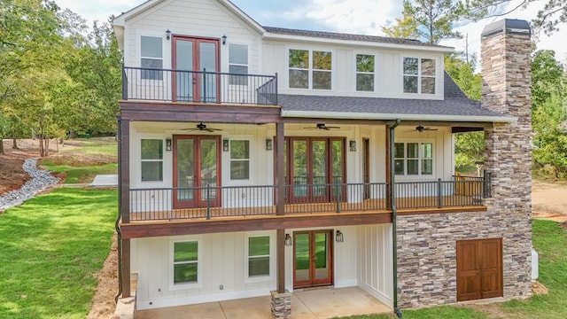 view of front of house featuring a ceiling fan and french doors