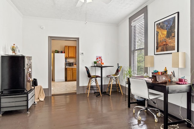 home office featuring crown molding, dark hardwood / wood-style floors, and a textured ceiling