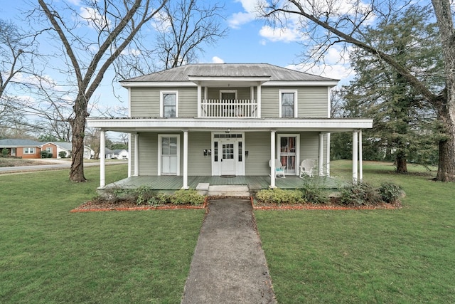 view of front of home featuring covered porch and a front lawn