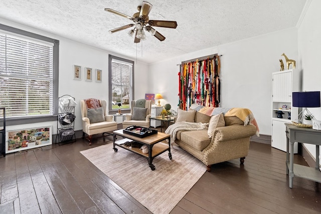 living room with dark hardwood / wood-style flooring, a textured ceiling, and ceiling fan