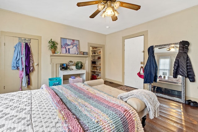 bedroom featuring hardwood / wood-style floors, a closet, and ceiling fan