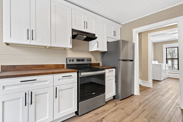 kitchen with butcher block counters, white cabinetry, stainless steel appliances, washer / clothes dryer, and light hardwood / wood-style floors