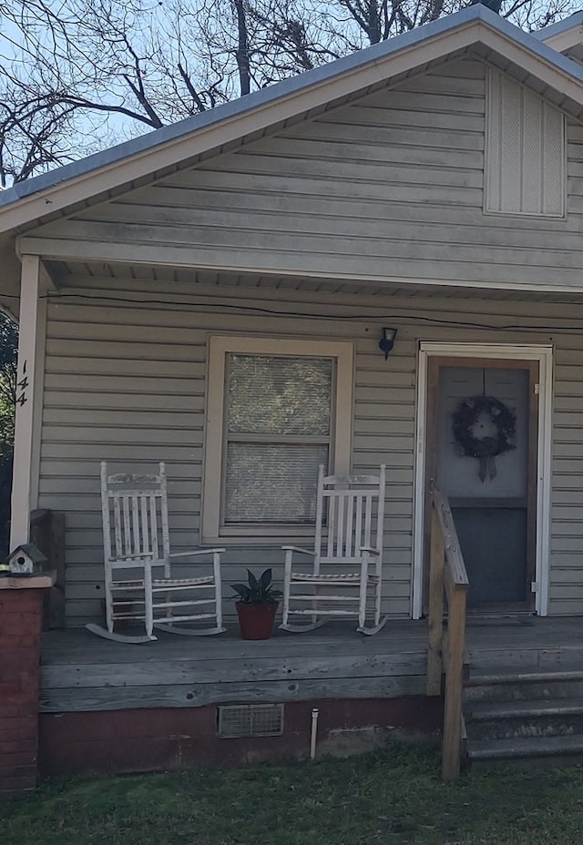 doorway to property with a porch