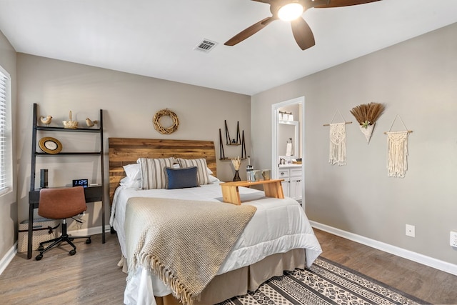 bedroom featuring ceiling fan, hardwood / wood-style floors, and ensuite bathroom