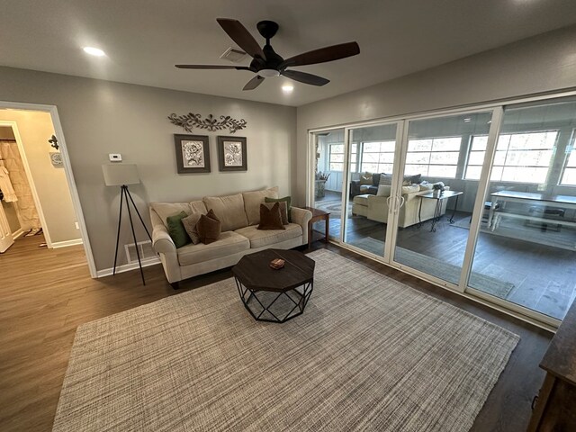 living room with ceiling fan and hardwood / wood-style flooring