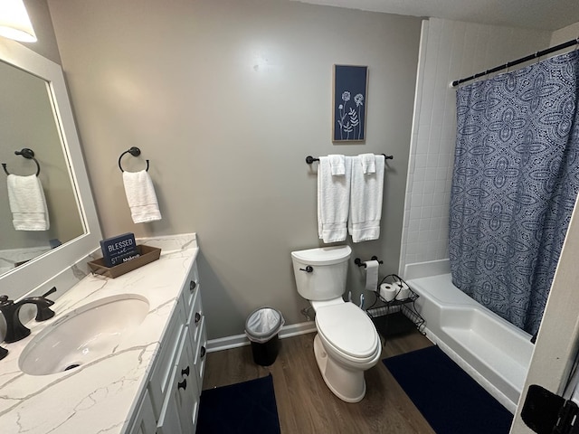 full bathroom featuring toilet, vanity, shower / tub combo with curtain, and hardwood / wood-style floors