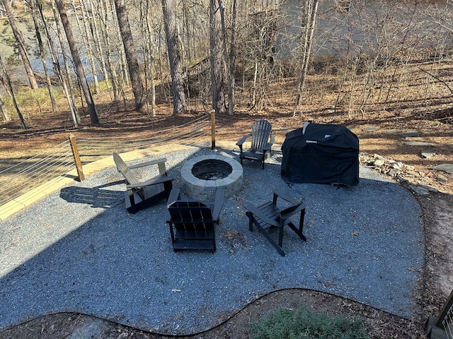 view of patio featuring an outdoor fire pit and grilling area