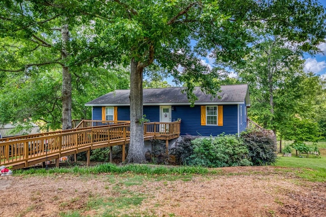 back of house with a wooden deck