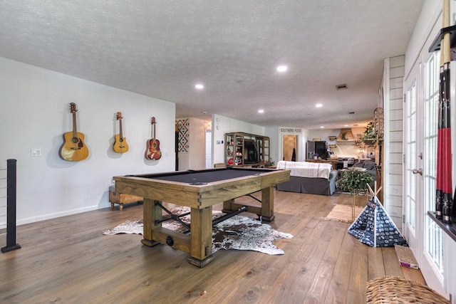 playroom with a textured ceiling, recessed lighting, pool table, baseboards, and light wood-type flooring