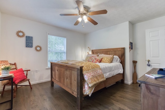 bedroom featuring a ceiling fan, dark wood finished floors, and baseboards