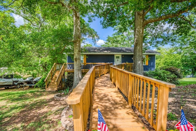 view of front facade featuring stairway and a deck