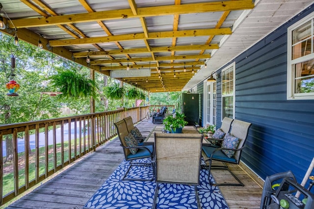 wooden deck with outdoor dining space