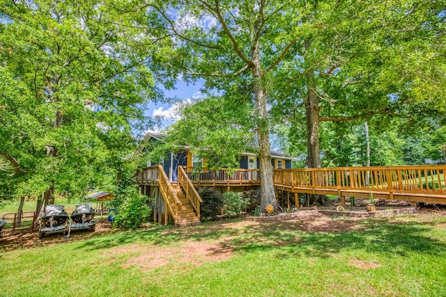 view of yard with stairway and a wooden deck