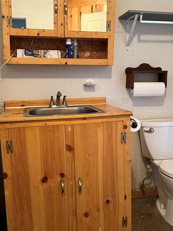 interior space with vanity and toilet