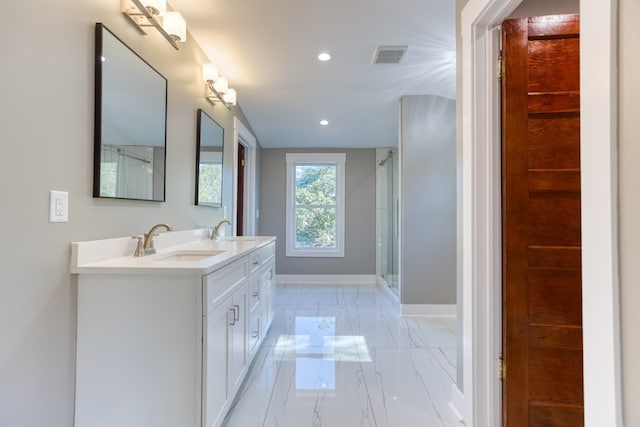 bathroom with vanity and an enclosed shower