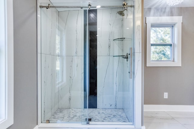 bathroom with a shower with shower door