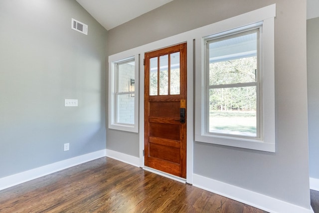 entrance foyer featuring dark hardwood / wood-style floors and vaulted ceiling