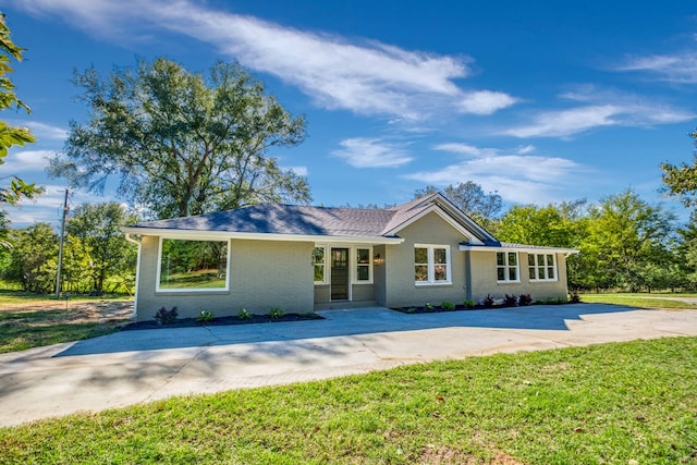 ranch-style house with a front lawn