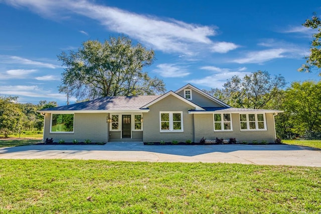 ranch-style home with a front yard